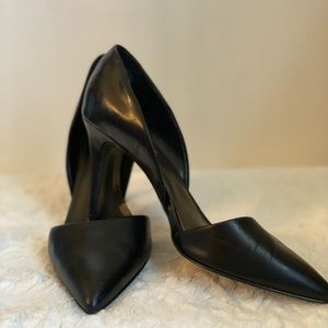 Black leather pumps